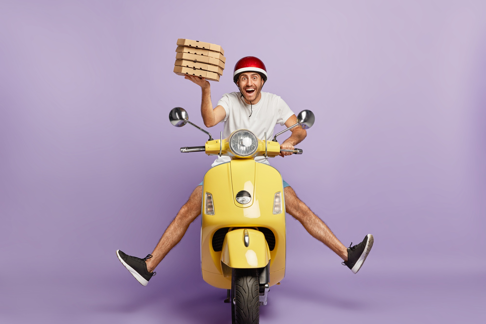 delivery man driving scooter holding pizzas delivery apps
