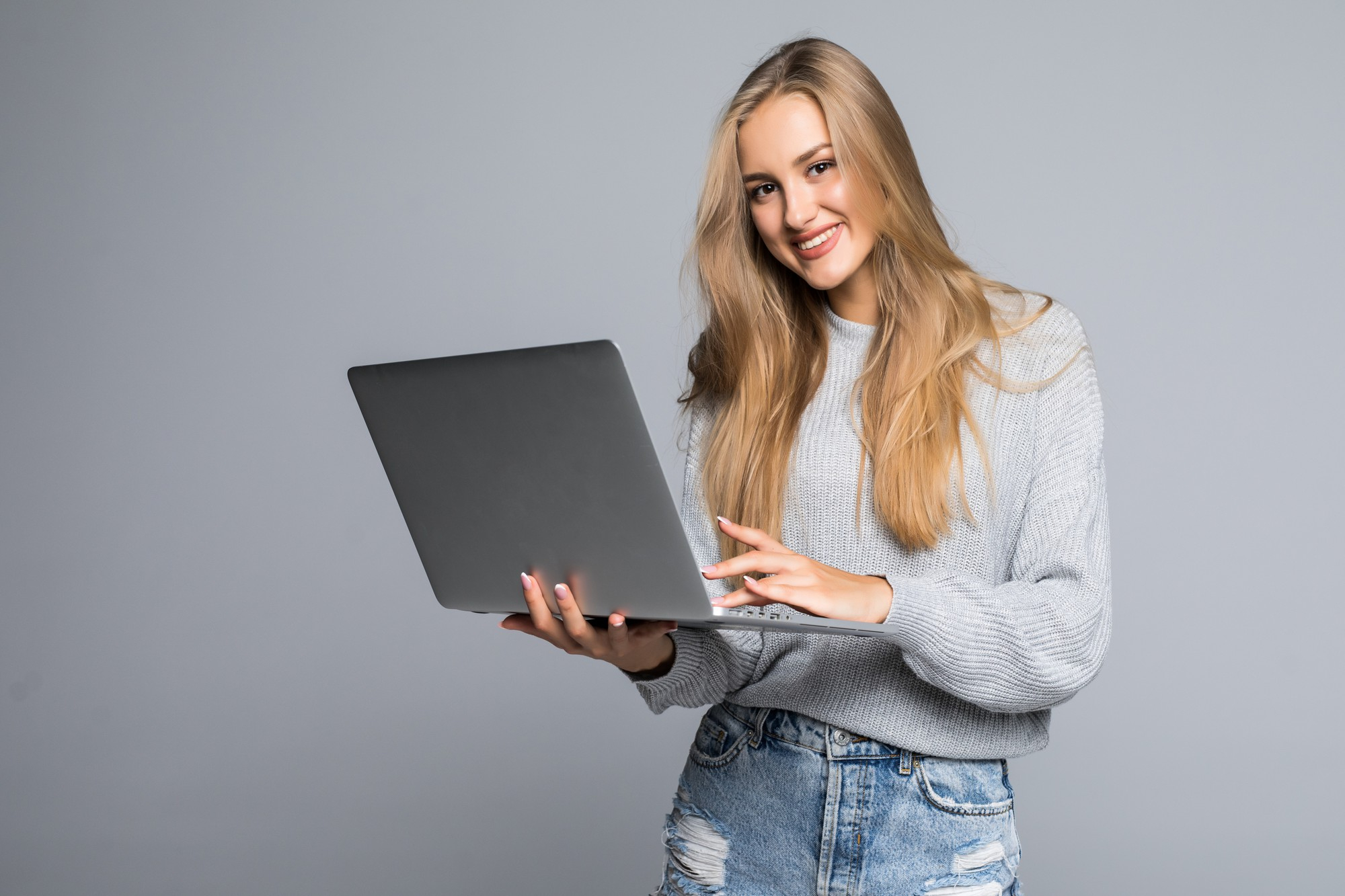 happy smilling woman holding laptop