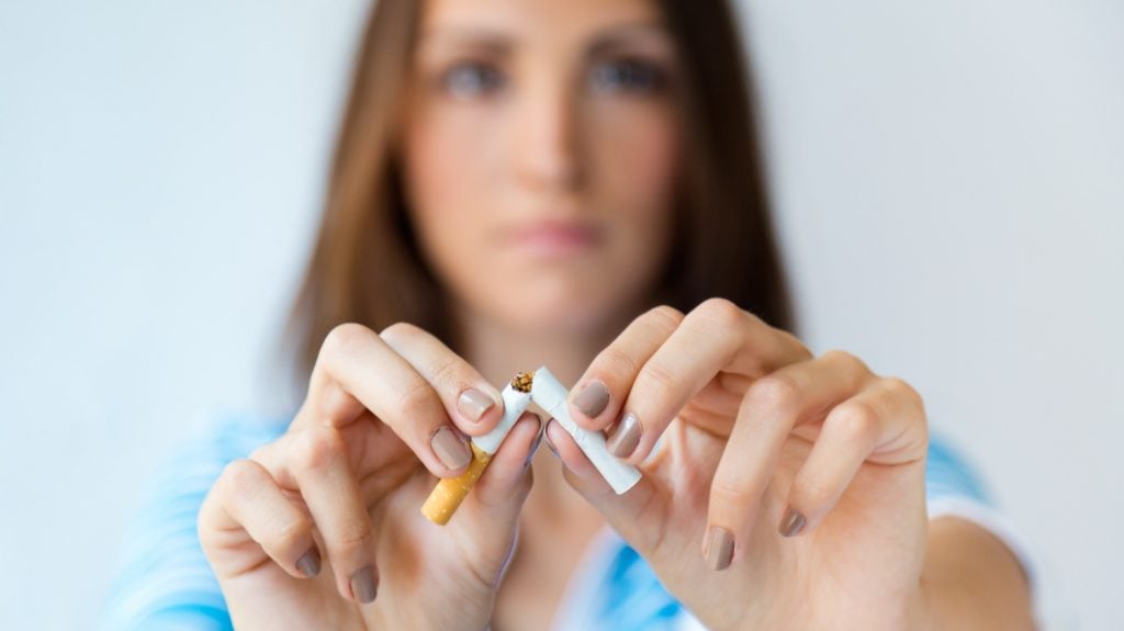 lady woman breaking cigarettes impact health issues and finances