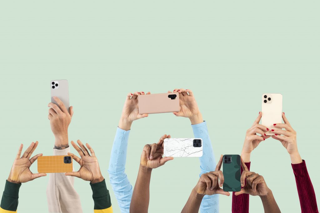 Social media audience crowd filming through smartphones