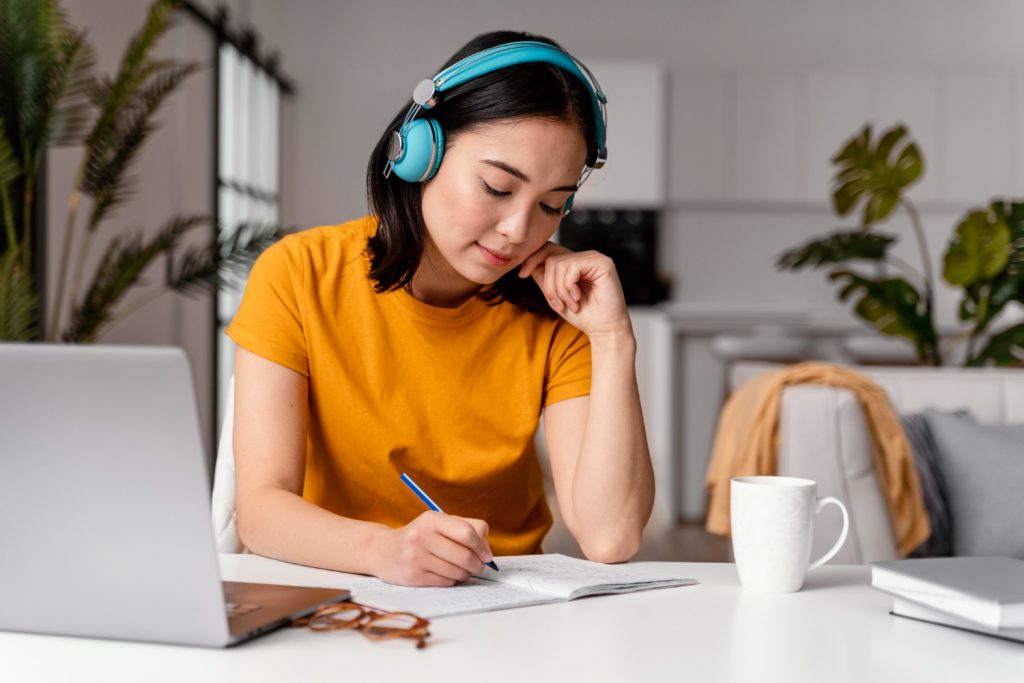 woman with headphones learning languages