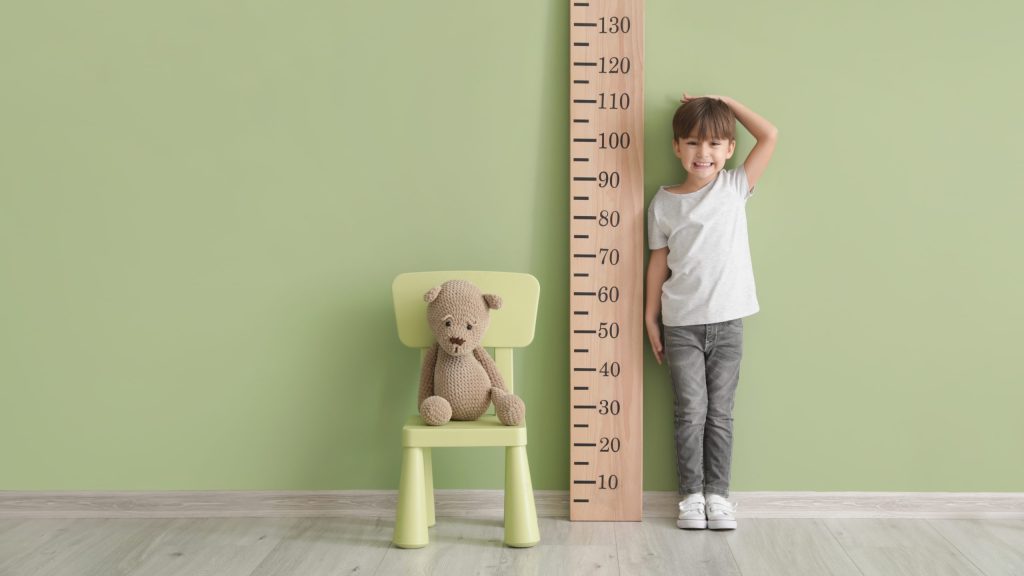 little boy measuring height