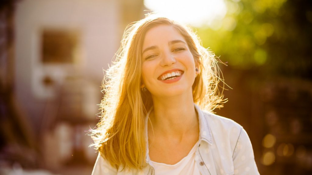 smilling happy woman improve mood no stress