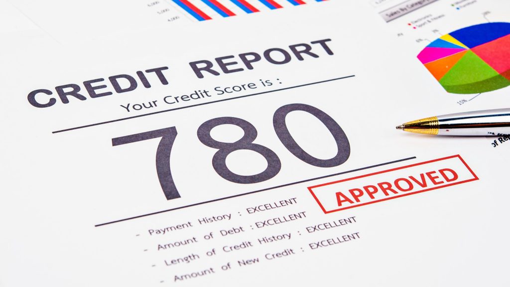Credit score report and approved with pen on business report document.
