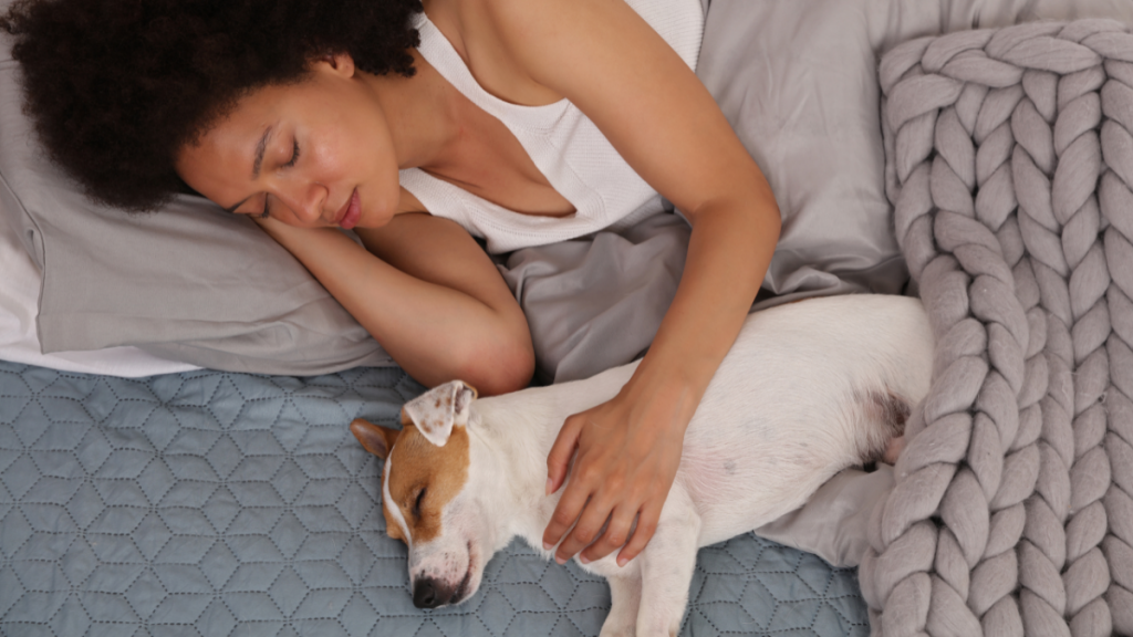 woman sleeping with her pet
