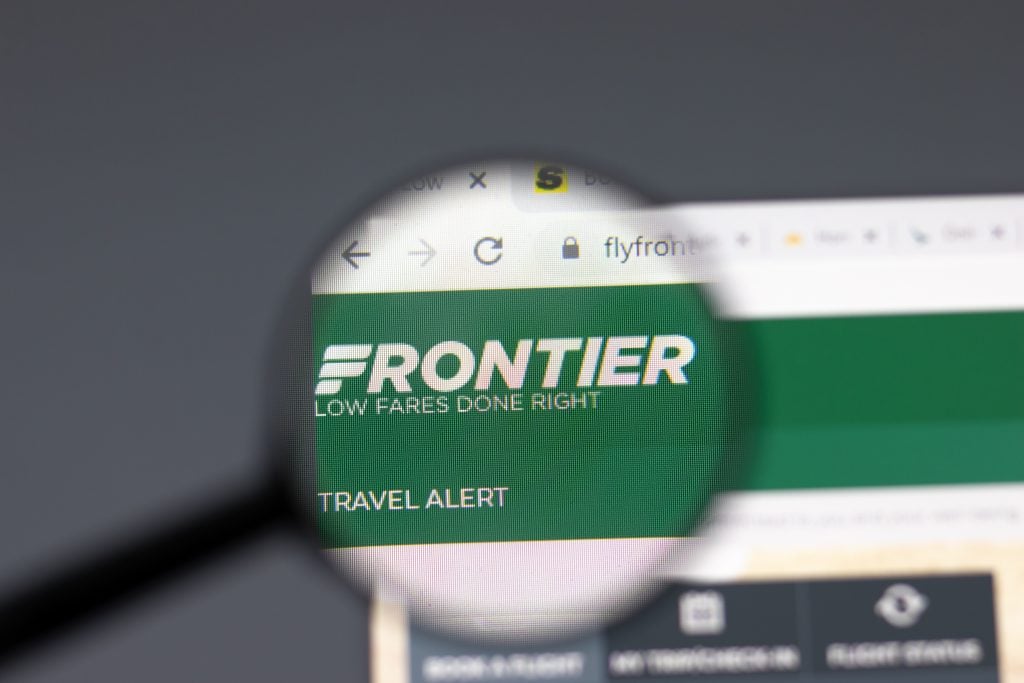 New York, USA - 15 February 2021: Frontier Airlines website in browser with company logo, Illustrative Editorial.